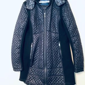 Black quilted jacket with shaping. And detach hood